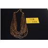 Image 1 : 10 STRAND NECKLACE, FEATURES THIN, DISK SHAPED NEISHI BEADS CRAFTED FROM NATURAL COCONUT SHELLS (30"