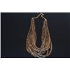 Image 2 : 10 STRAND NECKLACE, FEATURES THIN, DISK SHAPED NEISHI BEADS CRAFTED FROM NATURAL COCONUT SHELLS (30"