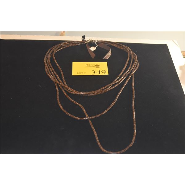 SINGLE STRAND NECKLACE, FEATURES THIN, DISK SHAPED NEISHI BEADS CRAFTED FROM NATURAL COCONUT SHELLS 