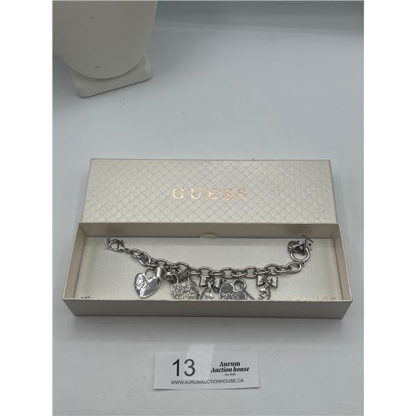 A Guess Silver Tone Charm Bracelet in Original Box