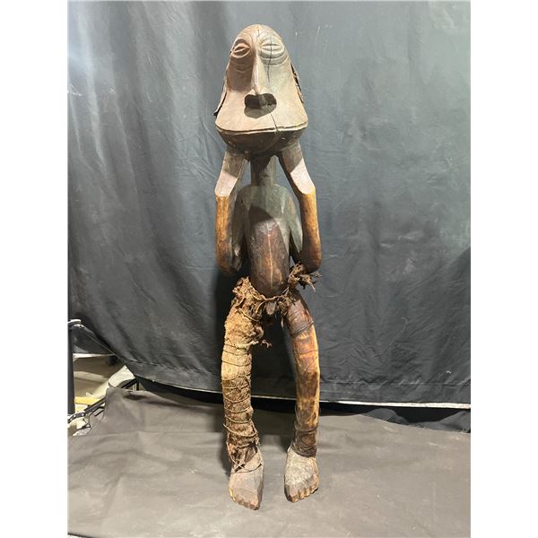 Carved Wooden Figure With Cloth and Fibre Wrappings, Stylised Facial Features