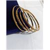 Image 1 : 4 18K GOLD PLATED BANGLES, ALL DIFFERENT RAISED ENGRAVED DESIGNS