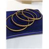 Image 2 : 4 18K GOLD PLATED BANGLES, ALL DIFFERENT RAISED ENGRAVED DESIGNS