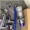 Image 2 : DYSON V10 CORDLESS STICK VACUUM WITH ACCESSORIES AND CHARGER WORKING