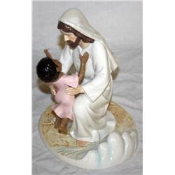 Sculpture Of A Man Holding A Kid