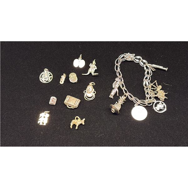 SILVER CHARM BRACELET WITH MULTIPLE CHARMS & 9 LOOSE SILVER CHARMS (43.8G)