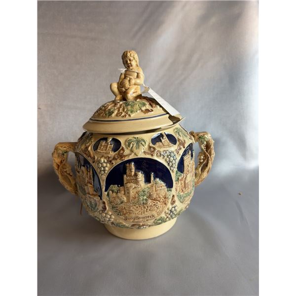 German Stoneware Covered Tureen With Cherub Finial and Relief Castle Decoration