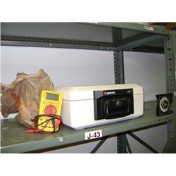CONTENTS OF SHELF--SENTRY SAFE AND SPERRY MULTIMETER