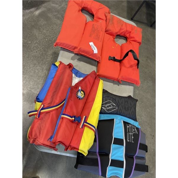 3 LIFE JACKETS AND A FLOATATION DEVICE