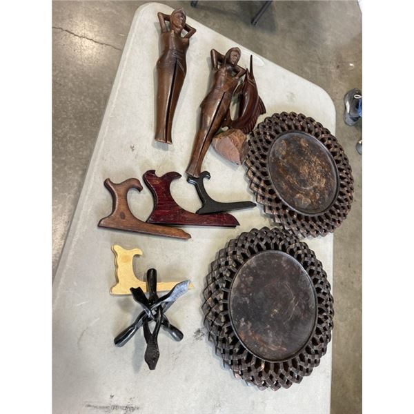 MAHOGANY CARVED SWORDFISH, WOODEN FIGURES AND TWO SERVING PLATES WITH STANDS