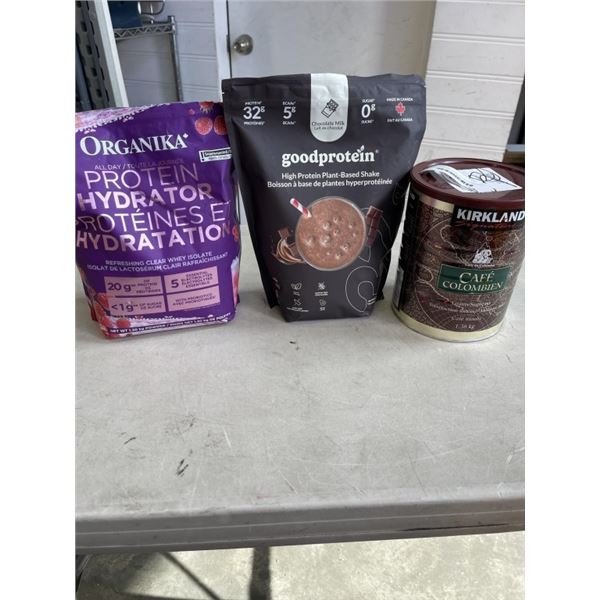 ORGANIKA AND GOOD PROTEIN POWDERS AND CAN OF KIRKJLAND COLUMBIAN COFFEE