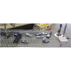 Shelf of Misc Phones