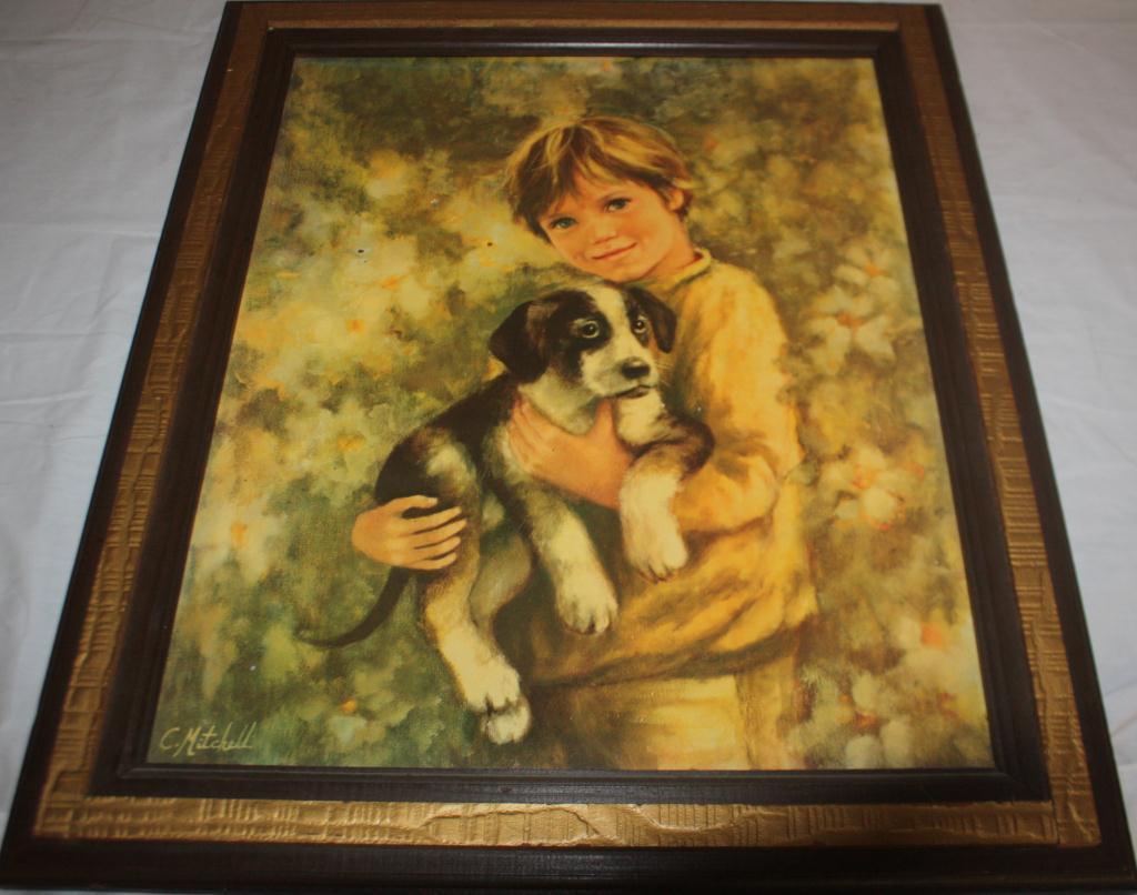 little boy holding dog painting