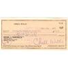Image 1 : Chill Wills Signs A Check