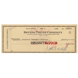 Walter Winchell Signs A Check