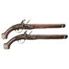 Image 1 : Pair of Engraved Mediterranean Flintlock Pistols with Relief Carved and Inlaid Stocks -A) Engraved O