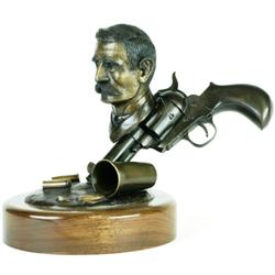 Bronze sculpture of "Doc" on walnut base.