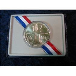 571. 1984 P Olympics Silver Dollar. Uncirculated. In the original case of issue.