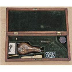 Original case for 1851 Navy Colt with small guard  with complete accessories. The case shows a green