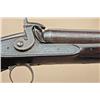 Image 2 : 10-gauge side-by-side shotgun, engraved “Majors,  Russel & Co.” on each lock. Barrel is  hand-engrav