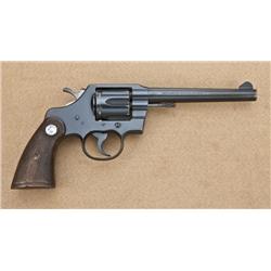 Colt Official Police, .38 special caliber  double-action revolver with factory heavy 6”  barrel, blu