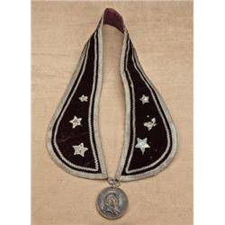 Cast bronze peace medal showing James Buchannan,  1857 date on embroidered velvet neck piece with  s