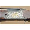 Image 2 : Browning Citori C-grade with gold set, 12, 20, 28,  410 gauges, serial #15562PN6A3. The gun shows  s
