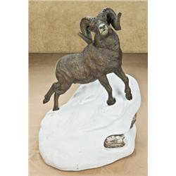 Doug Van Howd bronze of a ram on a snow-covered  rock, #1 of 50. Measuring 16” in length by 13” in  