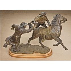 Original Western bronze by Doug Van Howd showing  two cowboys and horse in the midst of their  getaw