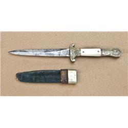 Spearpoint dirk with fancy German silver  die-stamped mounts, pearl grip scales, German  silver moun