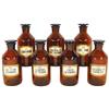 Image 1 : Pharmacy bottles (7), brown glass w/ground necks & stoppers, embossed Vitro-USA on bottom, old paper
