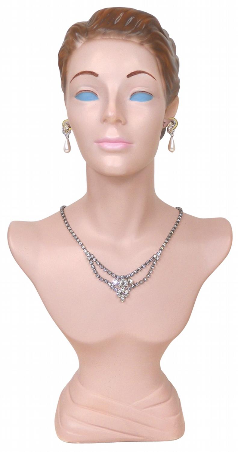 Mannequin bust, used in jewelry store, ears have metal inserts to hold