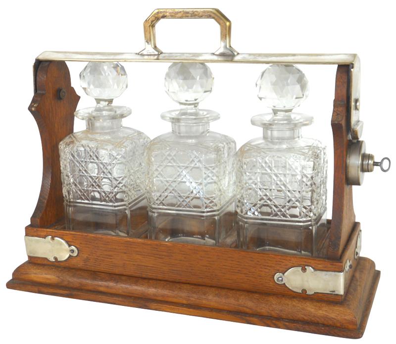 Locking liquor caddy, oak w/nickelplated trim & 3 fancy pressed glass
