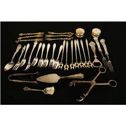 Lot of Sheffield, sterling, silver plate and brass serving forks, bottle opener, tongs - many  piece