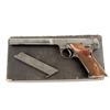 Image 1 : Hi-Standard Mdl E Cal .22LR SN:82801 Single action semi-auto target pistol. Blued finish, brown chec