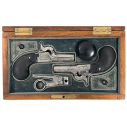 Fine Cased Pair of Le Page Marked Percussion Muff Pistols A) Folding Trigger Screw Barrel Le Page Mu