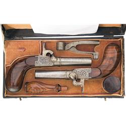 Cased Engraved Pair of European Percussion Muff Pistols with Accessories A) European Percussion Pist