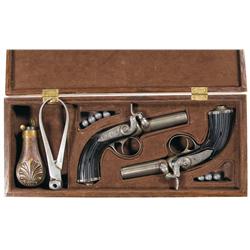 Cased Pair of Engraved N. Vivario-Plomneur Percussion Muff Pistols with Accessories A) Single Shot P