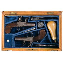Cased Pair of Consecutively Serialized Neville London Flintlock Pistols with Accessories A) Neville 