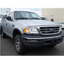 2001 SILVER FORD F-150 XL EXTENDED CAB W. CANOPY