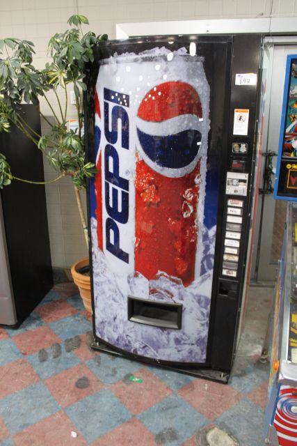 10 COMPARTMENT POP VENDING MACHINE