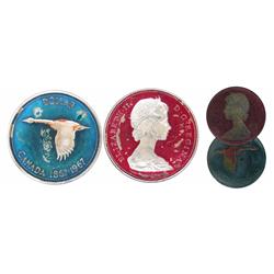 1967 $1 EF-AU Enameld coin. Painted in blue and geen colours.  Rarely seen.