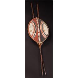 Pair of wood-handled iron spears and decorated leather shield from King Kong