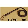 Image 1 : Braided leather bull whip in overall fair  condition with separation of the whip from  the grips (ea