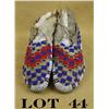 Image 1 : Pair of beaded Indian style moccasins in  overall fair condition with red, white, blue  and greasy y