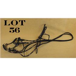 Fancy leather horse bridle with elaborate bit  by Crockett and engraved buckles and  rosettes, leath