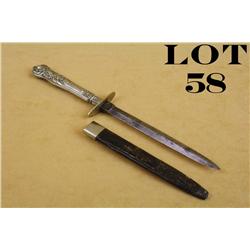 Small cutlery style dagger and leather sheath  approx. 9” overall with an approx. 5” blade  marked “