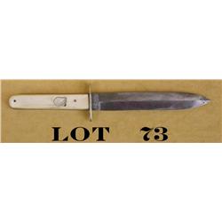 Spear point bowie knife with bone grips  approx. 9-1/2” overall with an approx. 6”  blade marked “Co