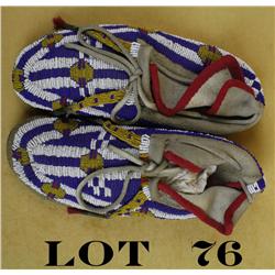 Beaded Indian moccasins in overall good to  very good condition with extensive coverage  of red, whi