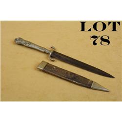 Cutlery style dagger and sheath approx.  9-1/2” overall with an approx. 5-1/2”  unmarked blade in ov